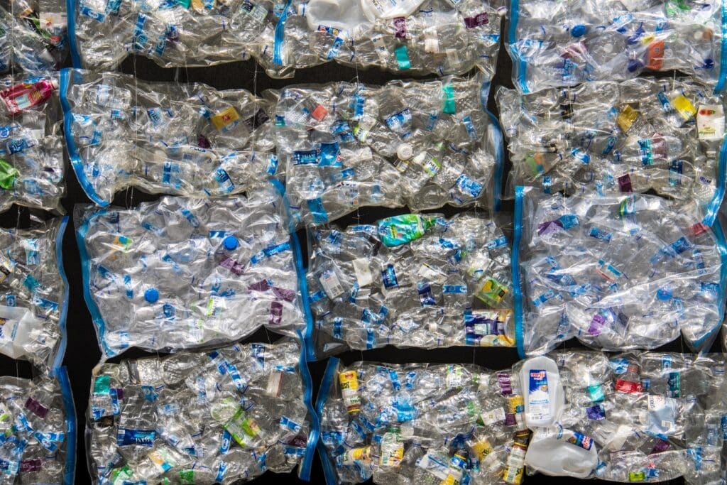 Top view of bins of disposable plastic water bottles